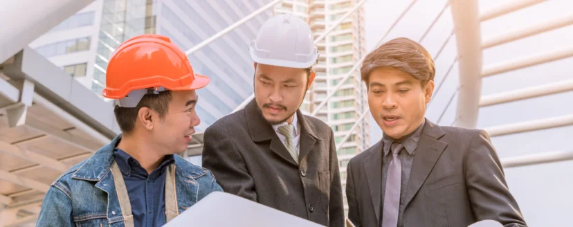manager-meeting-with-engineer-outdoor-site-discuss-plan-looking-blueprint